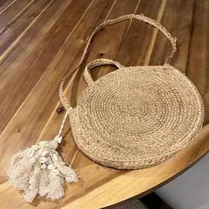 Woven jute bag with shell tassels